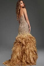 Back view of model in Jovani 39712 burgundy mermaid dress showcasing ruffle skirt.