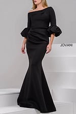 Model wearing Jovani 39739 black gown with off-the-shoulder neckline and mermaid silhouette.