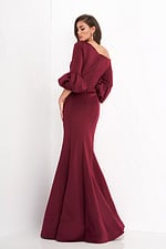 Back view of model in Jovani 39739 burgundy gown highlighting design and fit.
