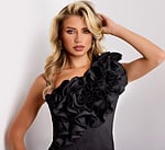 Close-up of floral ruffle design on black one shoulder gown