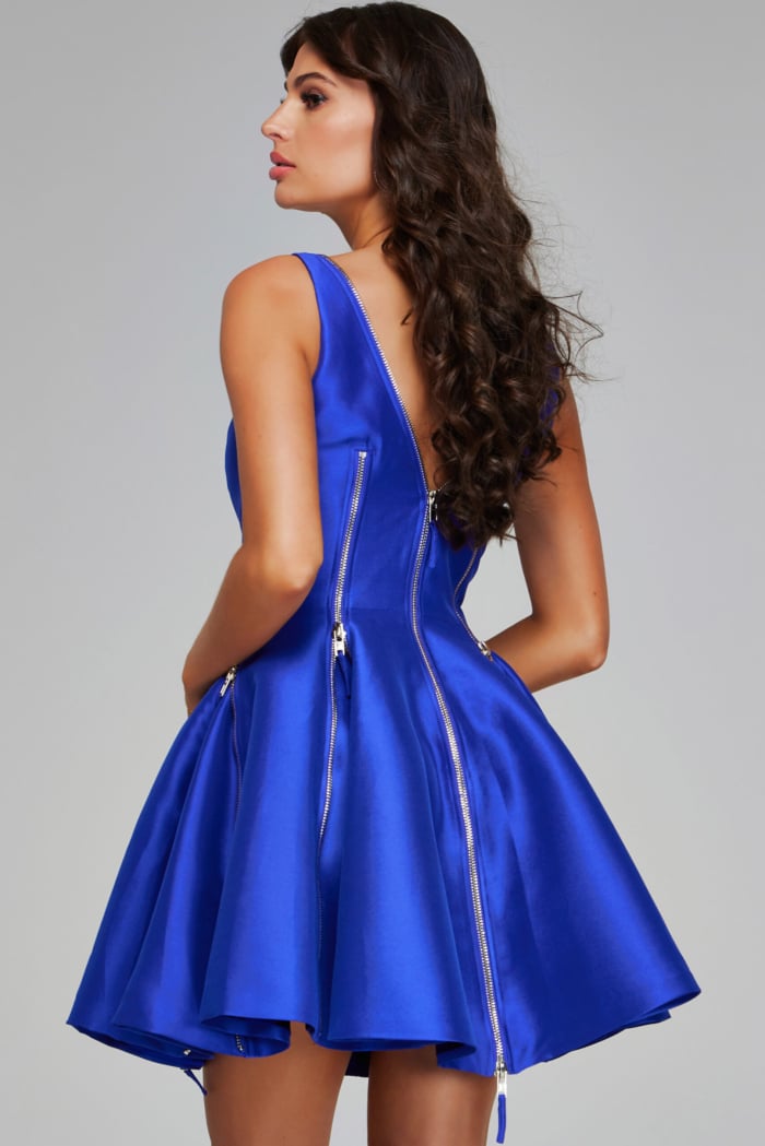 Back view of model wearing Jovani 39821, purple A-line dress showcasing zipper details.