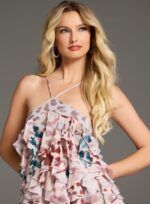 Close-up of model wearing Jovani 39822 print dress with halter neckline and ruffled detail.