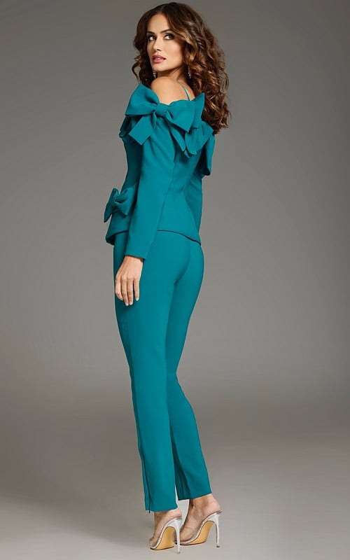 Model wearing Jovani 39840 turquoise ensemble, back view.