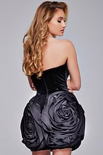 Model displaying Jovani 39848 black dress with rosette details, back view.