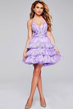 Model in Jovani 39880 short lavender dress with floral patterns and ruffled layers