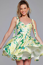 Model wearing Jovani 39881 vibrant green floral dress with sweetheart neckline.