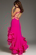 Model wearing Jovani 39893 fuchsia dress with open back and ruffled train, back view.