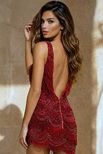 back view of red bodycon mini dress with deep V-back and beaded fringe