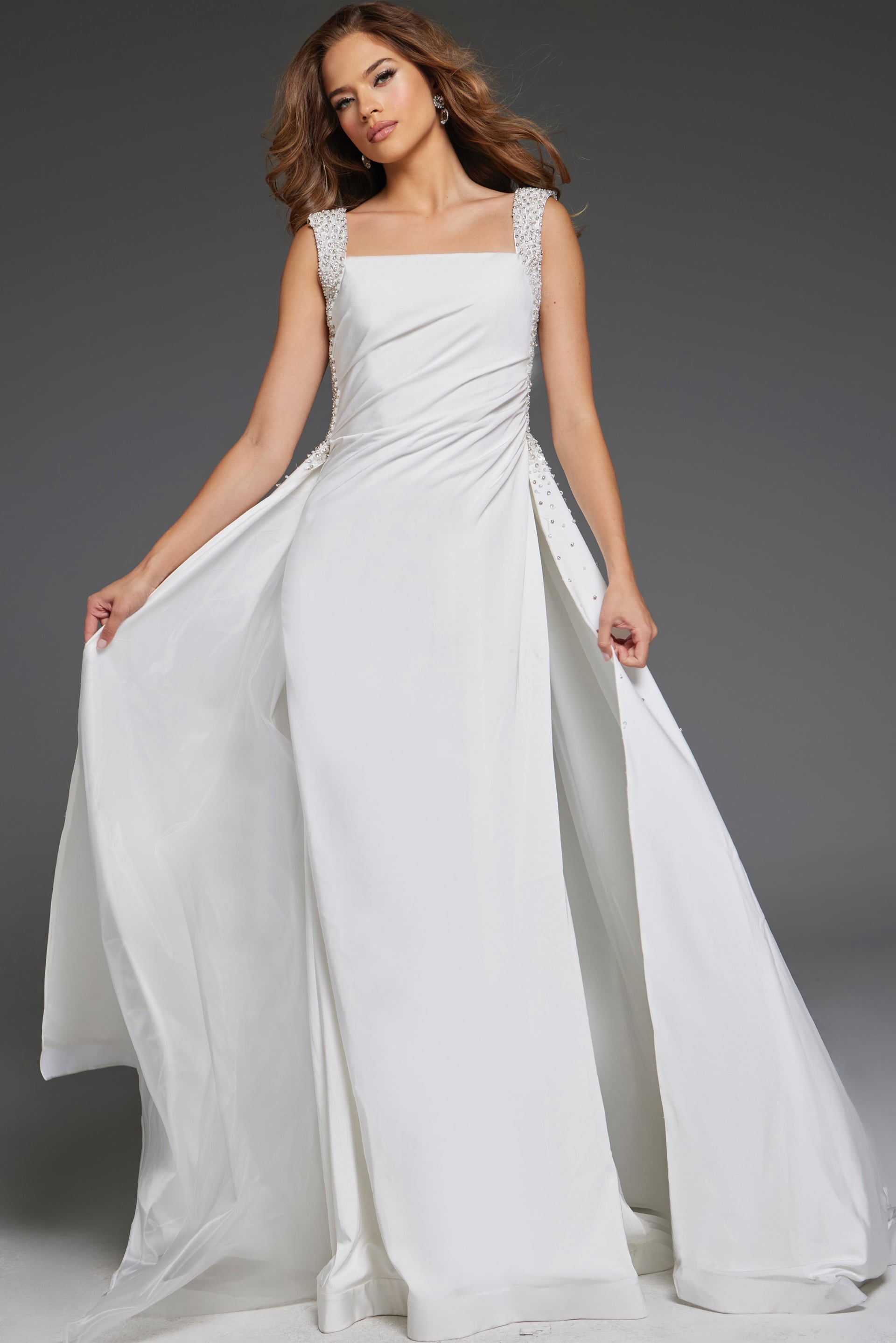 39921_WHITE-2 Model wearing Jovani 39921 elegant floor-length white gown with square neckline and embellished straps