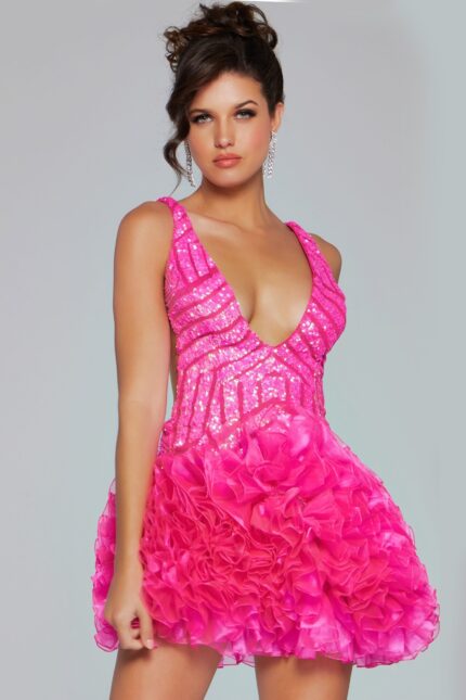 Model wearing Jovani 39931 dress in pink with deep V-neckline and ruffled skirt.