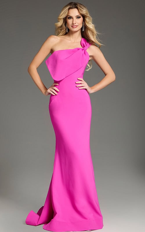 Model wearing Jovani 39971 pink gown with one-shoulder neckline and bow detail.