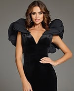 close-up of model wearing Jovani 39973 black gown with deep V-neckline