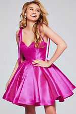 Model wearing Jovani 39979 pink dress with sweetheart neckline and tied shoulders.
