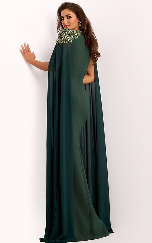 Back view of green formal cape gown with jeweled shoulders