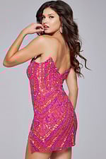 Model posing in back view of Jovani 40003 blush sequin short dress.