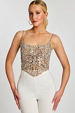 sequin pattern and structured silhouette of silver crop top.