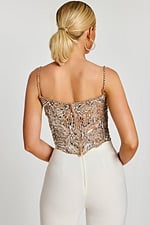 Back view of silver embellished crop top with zipper closure and sequin straps.