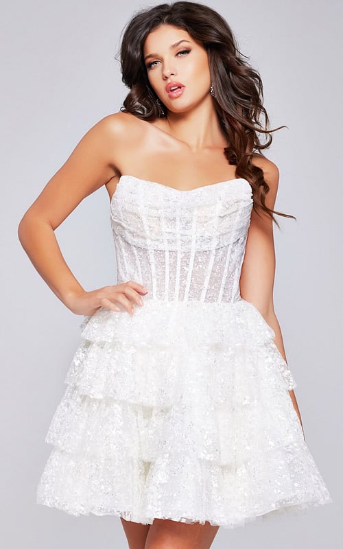 Model wearing Jovani 40030 white dress with a strapless design and tiered skirt, front view close-up.