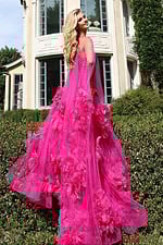 Glamorous pink tulle dress featuring textured 3D flowers and flowing silhouette