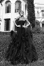 Couture-inspired sheer gown with cascading flower embellishments