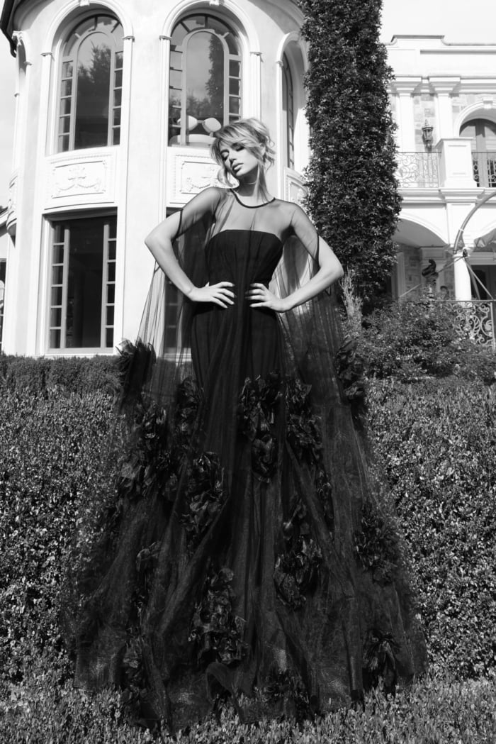 Couture-inspired sheer gown with cascading flower embellishments