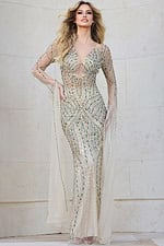 Model wearing Jovani 40110 nude embellished gown with sheer sleeves.