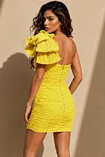 back view of yellow bodycon mini dress with plunge V-neck, voluminous one-shoulder ruffle, and all-over ruching
