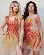 Two models wearing Jovani dresses, including 40157 with flame embellishments.