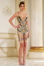 Model wearing Jovani 40171 showcasing geometric sequin design in a fitted, sleeveless dress.