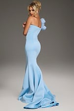 Model wearing Jovani 40201 blue mermaid dress with floral shoulder embellishment, back view.