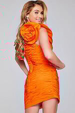 Model wearing Jovani 40205 orange mini dress with floral applique, back view.