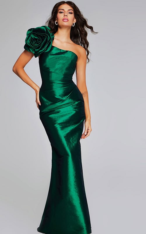 Model wearing Jovani 40206 green mermaid gown with a one-shoulder rose detail from the front.