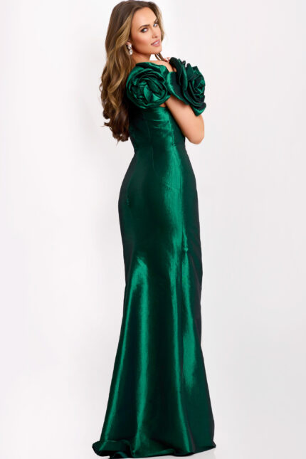 Back view of fitted green formal gown with rosette sleeves