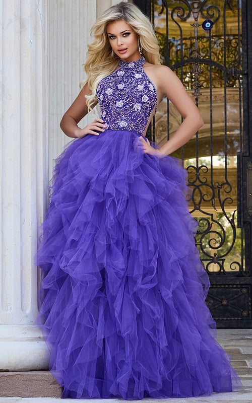 Model wearing Jovani 40218 lilac gown with halter neckline and full tulle skirt.