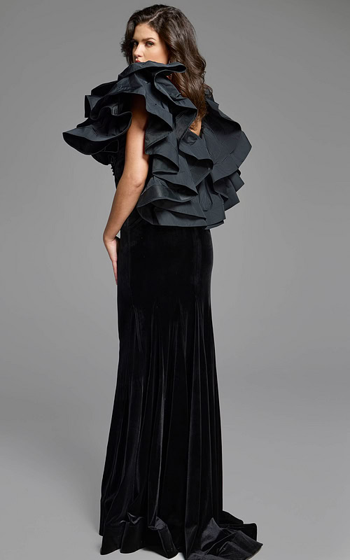 Designer velvet dress with striking shoulder ruffles and a classic silhouette