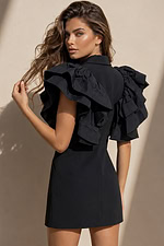back view of black blazer mini dress with plunging V-neck, ruffle sleeves, and jeweled button