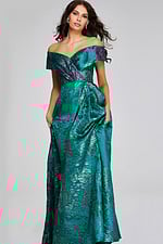 Model wearing Jovani 40296 green dress, off-the-shoulder, front view, holding skirt.
