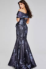 Back view of model in Jovani 40309 mermaid gray gown, highlighting the elegant train and floral motifs.