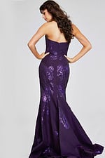 Model wearing Jovani 40318 in purple, front view capturing elegance.