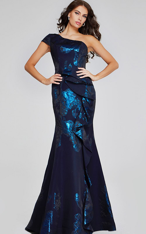 Model wearing Jovani 40320 navy gown with one-shoulder neckline and ruffle details, front view.