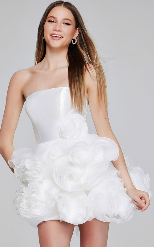 Model wearing Jovani 40334 white mini dress, showcasing floral appliqués and a strapless neckline