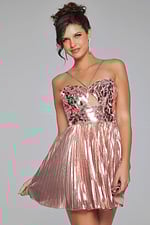 front view of model in Jovani 40351 showcasing pink dress with sweetheart neckline and pleated skirt