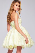 Model displaying side back angle of Jovani 40374 yellow dress.