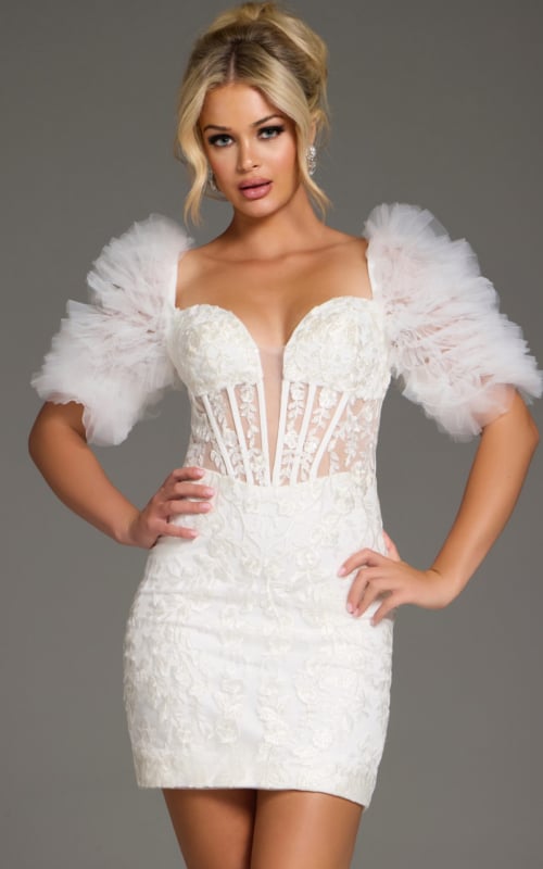 Model wearing Jovani 40426 mini dress with sweetheart neckline and puff sleeves in white.