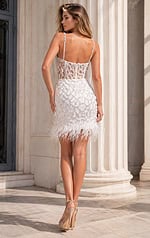 back view of fitted prom dress with open back and thin straps