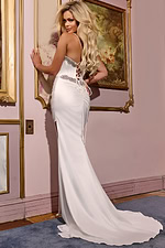 Back view of model wearing 40452 ivory gown with lace-up detailing.