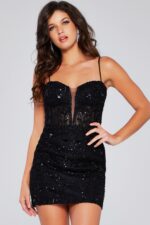 Model wearing Jovani 40498 black mini dress from the front with lace and beaded embellishments.