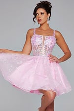 Model wearing Jovani 40501 pink dress showcasing floral adorned bodice, front view.