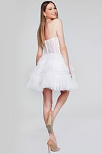 Model showing back of Jovani 40580 dress with layered tulle skirt and lace details.