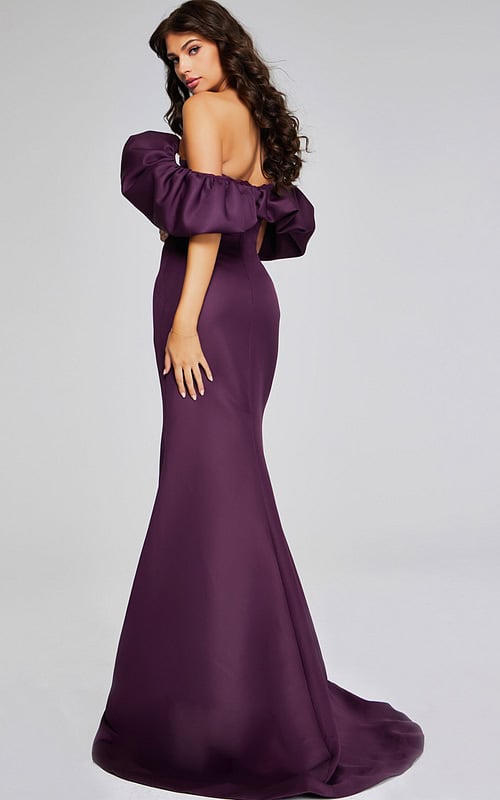 Model in Jovani 40596 burgundy gown back view with ruffled off-the-shoulder neckline.